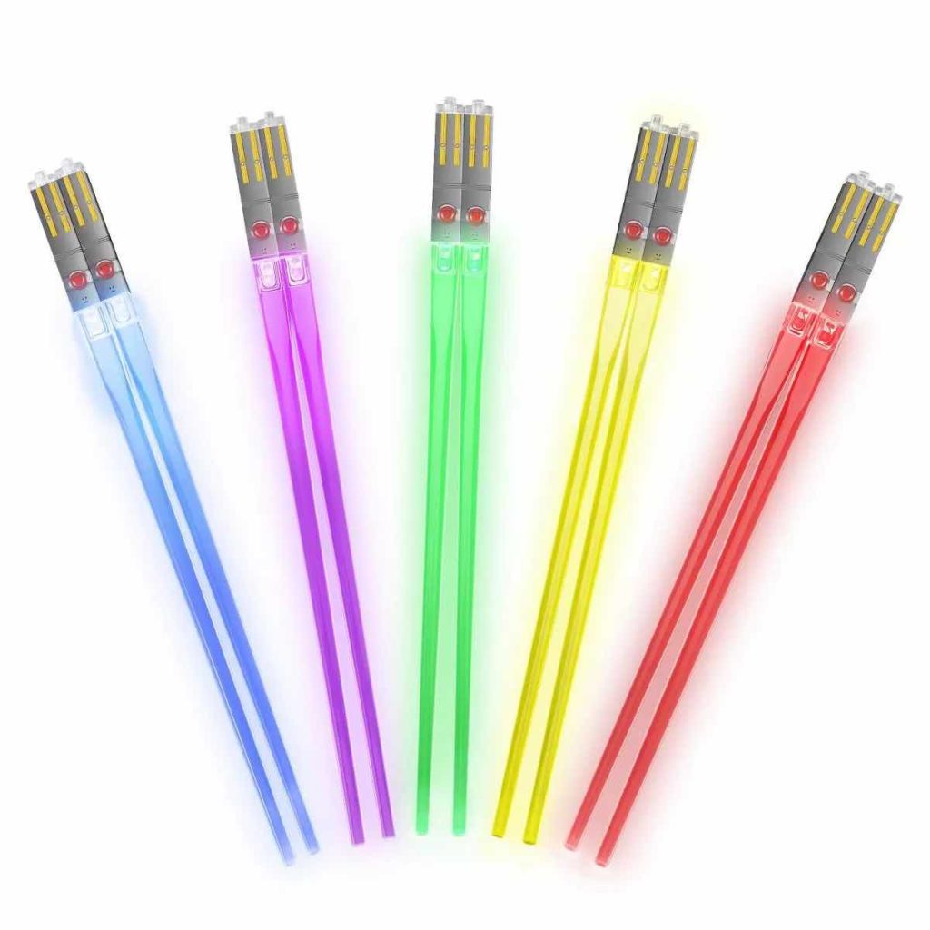 five different colors of glowing lightsaber chopsticks