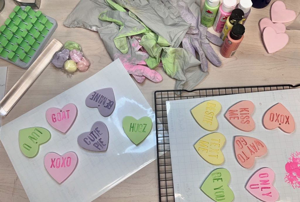 finished hearts laying out to dry beside the supplies used to make them