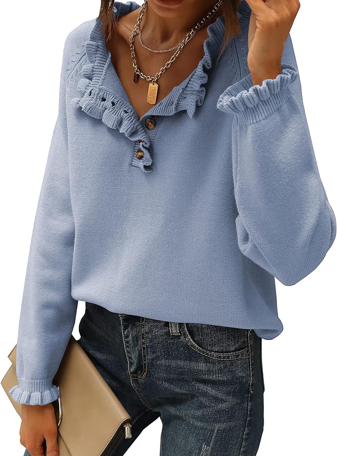 woman weaaring a sky blue sweater with button up v neck and sweet pleating around the neck and cuffs