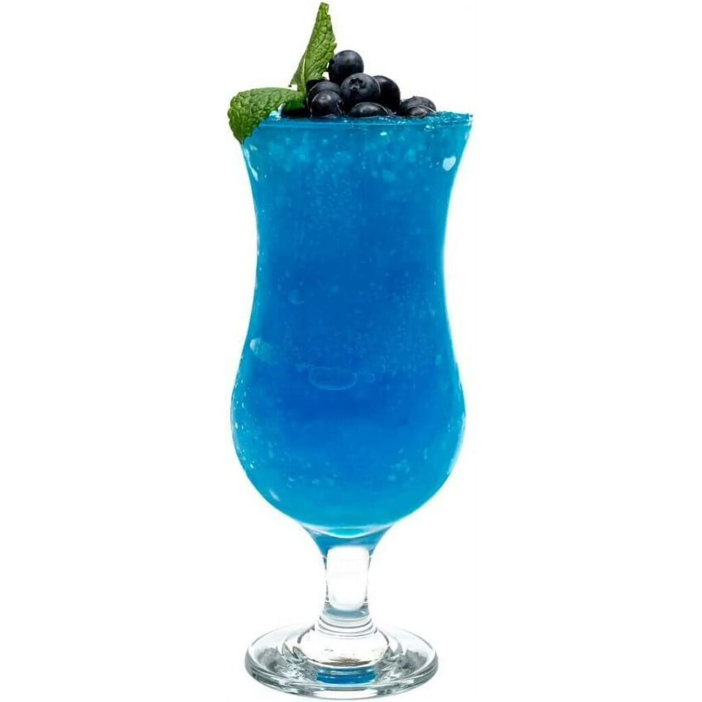 A vibrant blue cocktail in a tall, curved glass, reminiscent of DIY Mardi Gras decorations, topped with fresh blueberries and a sprig of mint. The drink is icy, suggesting a refreshing texture perfect for any festive occasion.