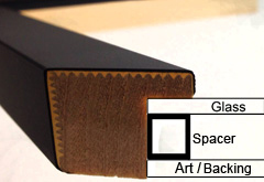 Close-up of a cross-section of a picture frame, perfect for DIY floating mount art. The layers are labeled as glass, spacer, and art/backing. The frame boasts a sleek black exterior with a wooden interior. An inset highlights the layers for clarity.