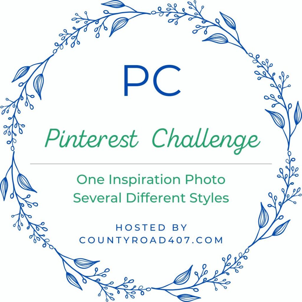 A circular floral frame surrounds the text: "PC Pinterest Challenge. One Inspiration Photo Several Different Styles. Hosted by countyroad407.com" in blue and green lettering, perfect for those seeking inspiration for a style round coffee table setup.
