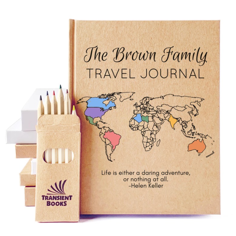 A travel journal titled "The Brown Family Travel Journal" with a world map on the cover, colored pencils beside it, and a Helen Keller quote: "Life is either a daring adventure, or nothing at all.