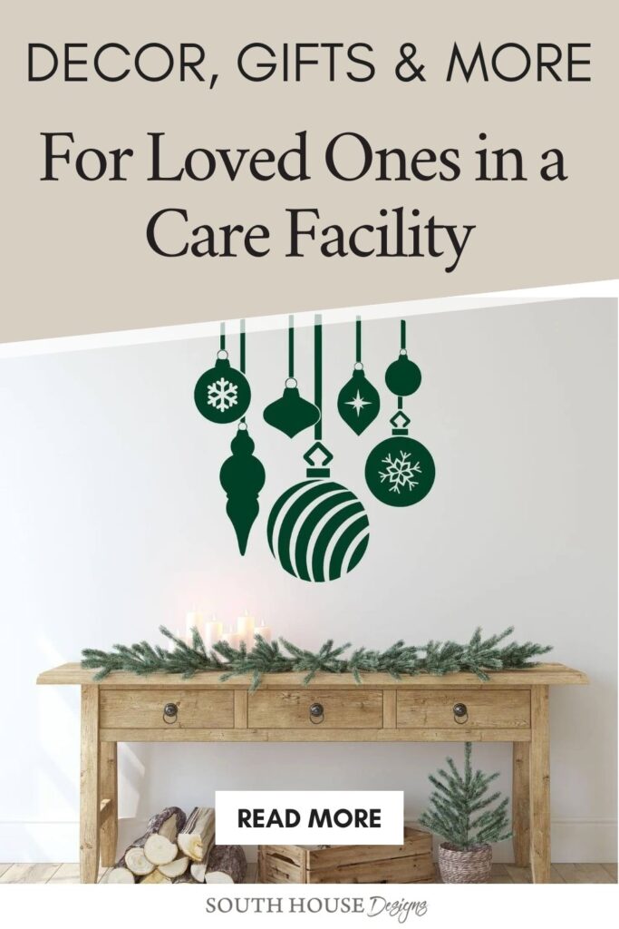 A festive graphic with text reading "Brighten Holiday Stay in Care Facilities—Decor, Gifts & More For Loved Ones" above green ornaments, and a wooden table decorated with pine branches below. A "Read More" button is centered on the table.