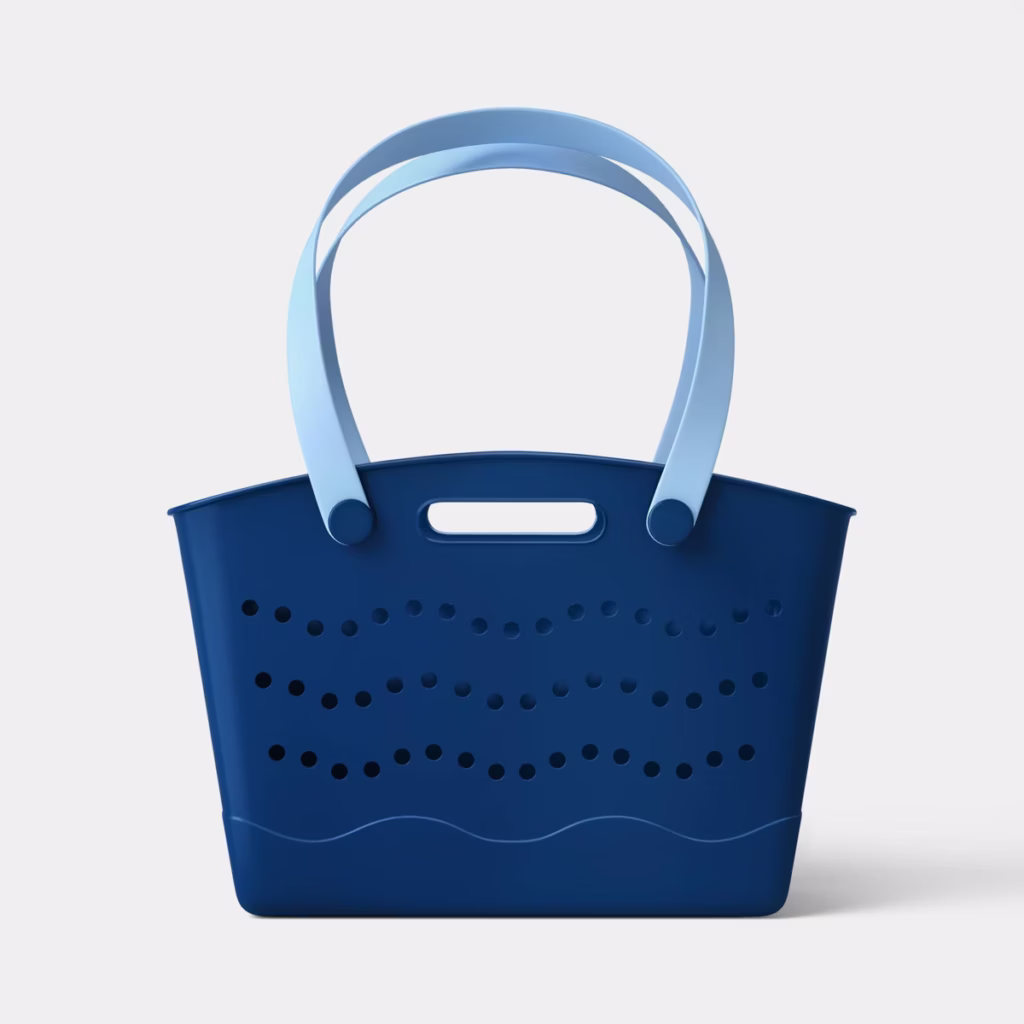 A blue plastic tote bag with light blue handles, featuring wavy perforated holes on the sides and a small handle cutout near the top, set against a plain white background.